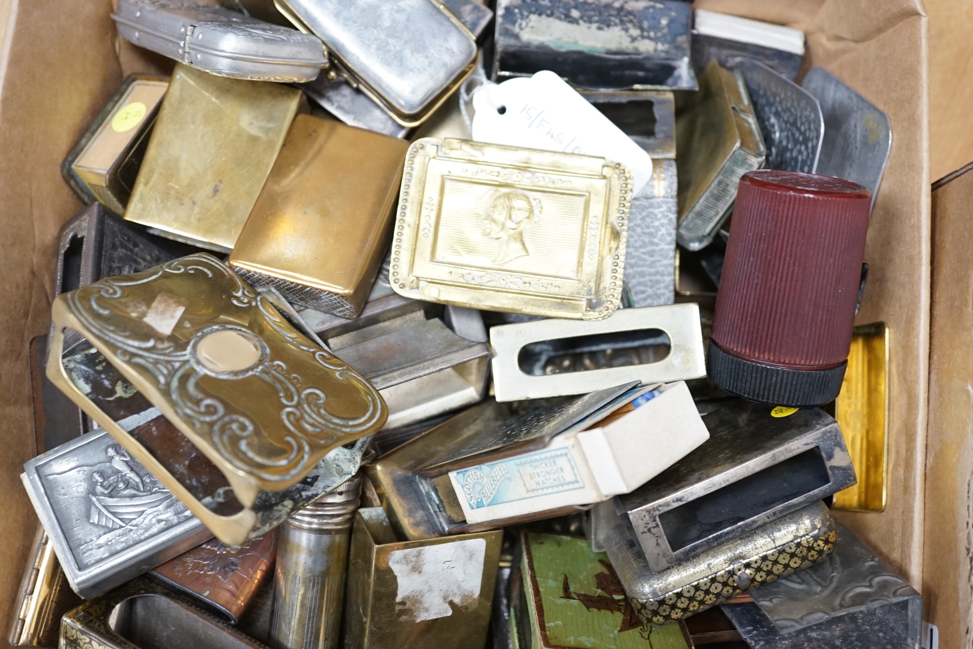 Two boxes of mixed metal matchbox holders including brass and copper